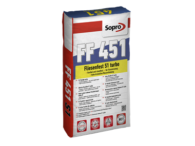 Jeden sáček šedého flexibilního lepidla na pokládku dlaždic